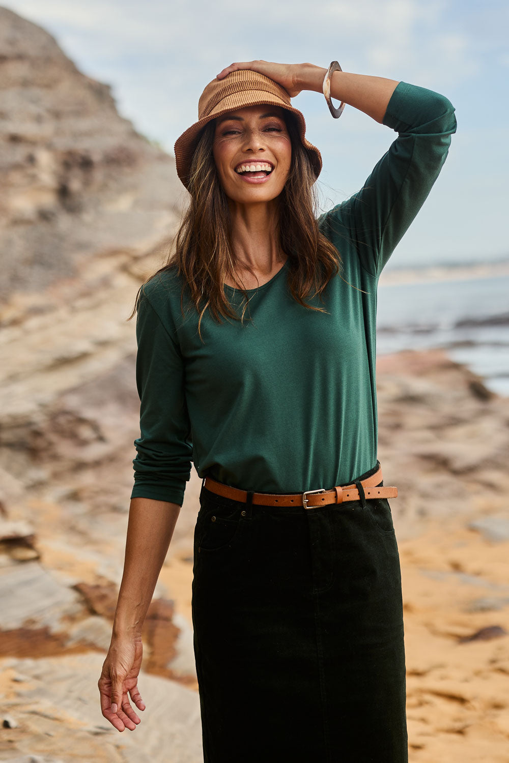 Model Amanda wearing size 10 of The Classic Long Sleeve Tee in colour Pinegreen (Green), from the front, showing the whole outfit