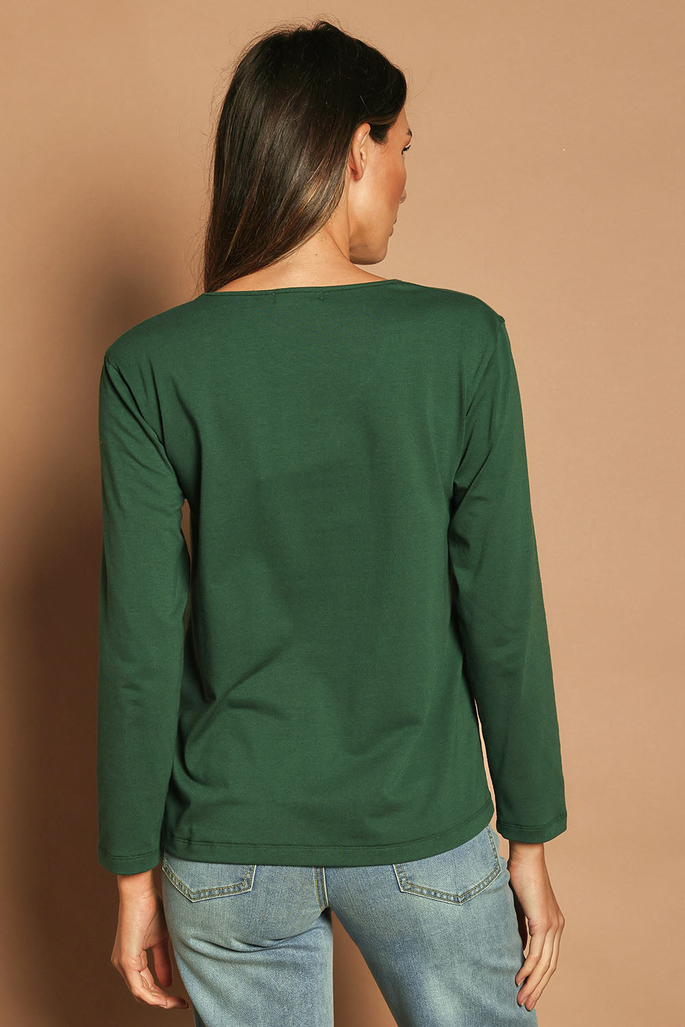 Model Madeline wearing size 10 of The Classic Long Sleeve Tee in colour Pinegreen (Green), from the back
