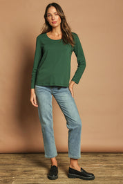 Model Madeline wearing size 10 of The Classic Long Sleeve Tee in colour Pinegreen (Green), from the front, showing the whole outfit