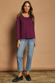 Model Madeline wearing size 10 of The Classic Long Sleeve Tee in colour Plum (Purple), from the front, showing the whole outfit