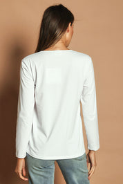 Model Madeline wearing size 10 of The Classic Long Sleeve Tee in colour White (White), from the back