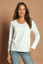 Model Madeline wearing size 10 of The Classic Long Sleeve Tee in colour White (White), from the front, showing the whole outfit