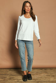 Model Madeline wearing size 10 of The Classic Long Sleeve Tee in colour White (White), from the front, showing the whole outfit