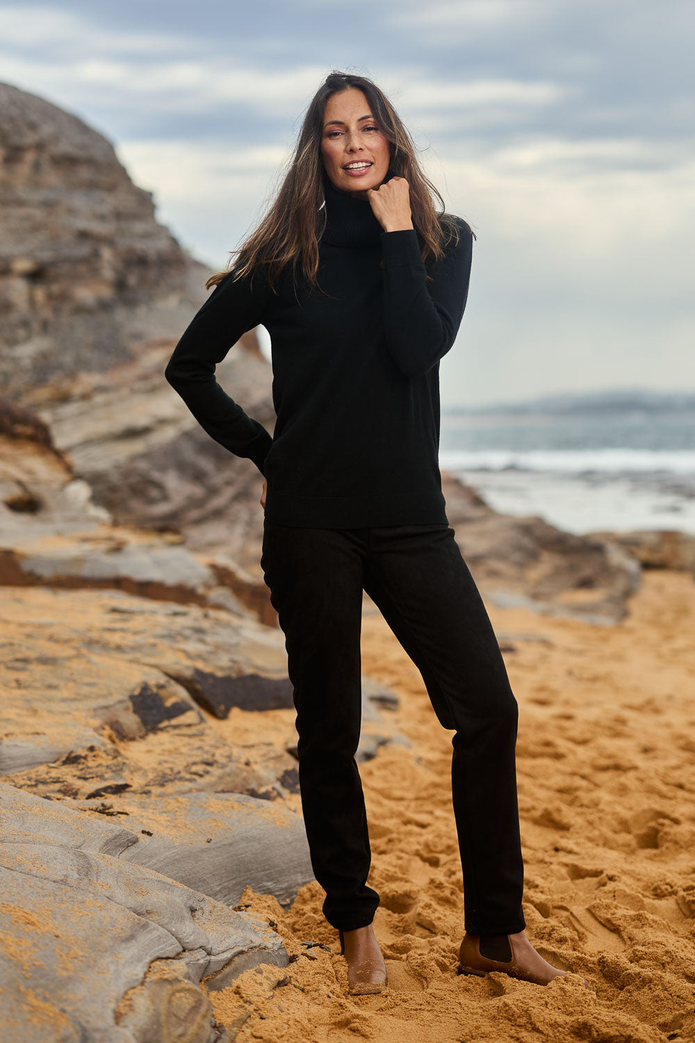 Model Amanda wearing size 10 of The Luxe Faux Suede Pull On Pant in colour Black (Black), from the front, showing the whole outfit