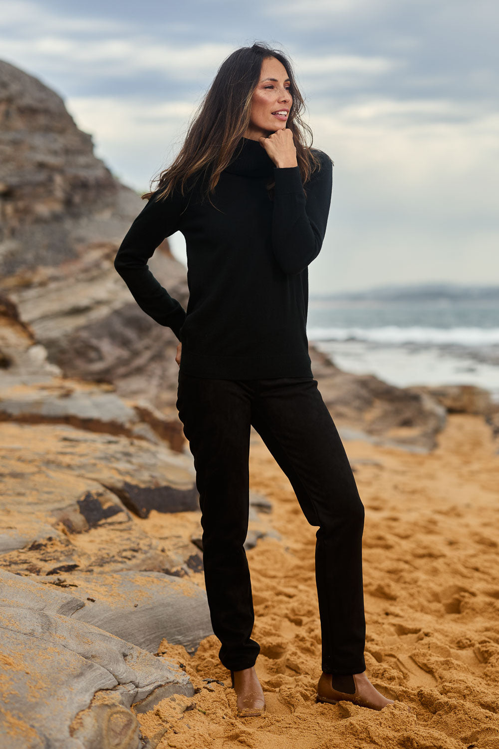 Model Amanda wearing size 10 of The Luxe Faux Suede Pull On Pant in colour Black (Black), from the front, showing the whole outfit