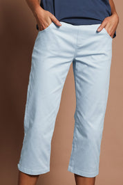 Model Madeline wearing size 10 of The Pull On Cotton Cropped Pant With Pockets in colour Bluegrey (Blue), from the front, cropped image