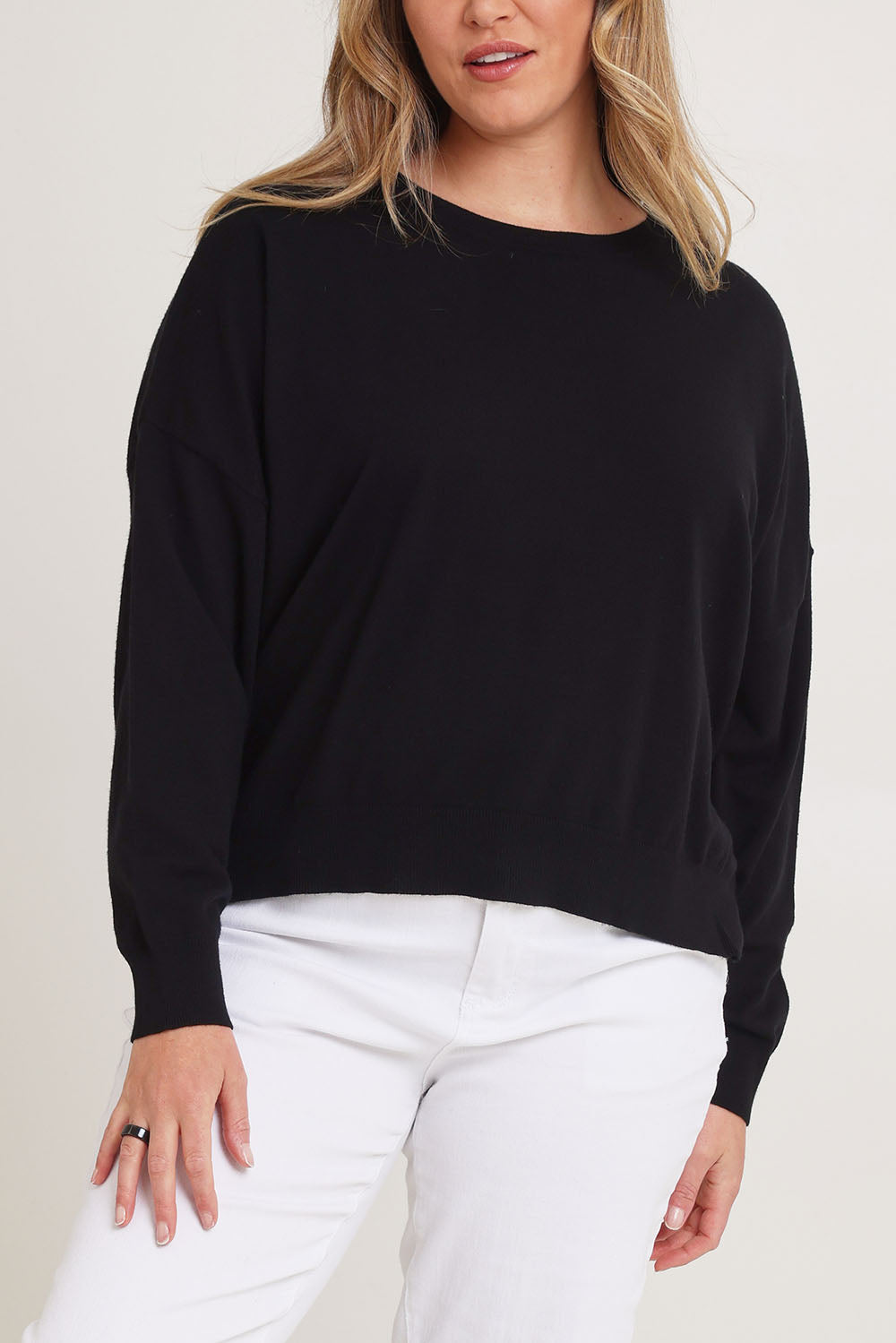 Model Chanel wearing size XL of The Essential Cropped Modal Blend Jumper in colour Black (Black), from the front, cropped image