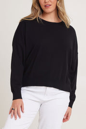 Model Chanel wearing size XL of The Essential Cropped Modal Blend Jumper in colour Black (Black), from the front, cropped image