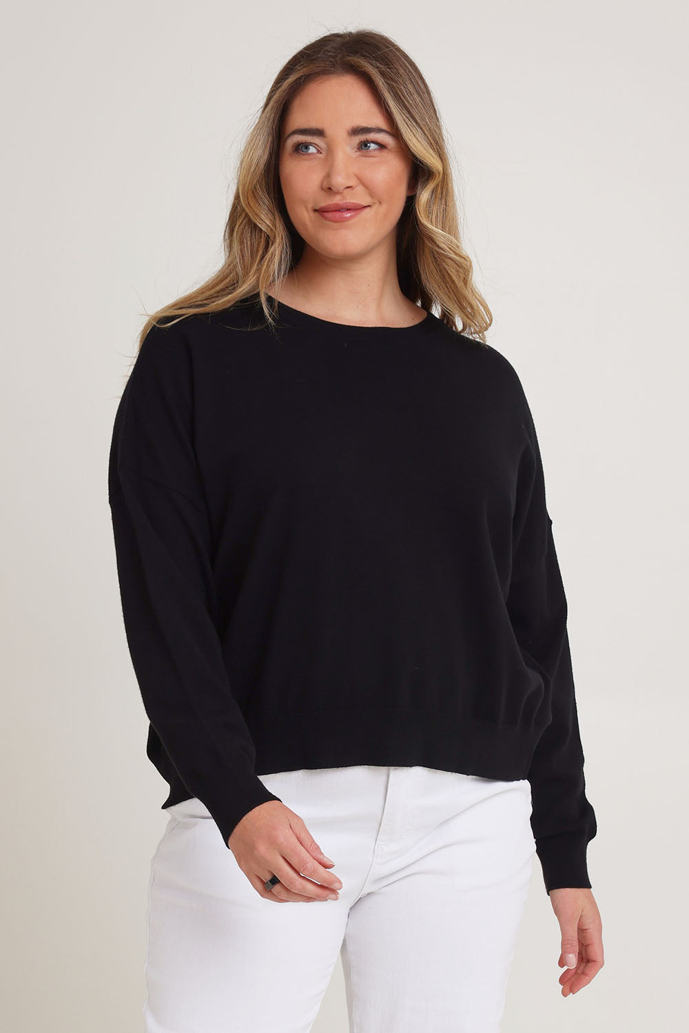 Model Chanel wearing size XL of The Essential Cropped Modal Blend Jumper in colour Black (Black), from the front, cropped image
