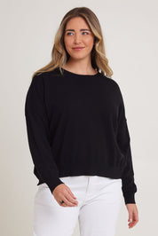 Model Chanel wearing size XL of The Essential Cropped Modal Blend Jumper in colour Black (Black), from the front, cropped image