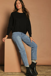 Model Madeline wearing size S of The Essential Cropped Modal Blend Jumper in colour Black (Black), from the front, showing the whole outfit