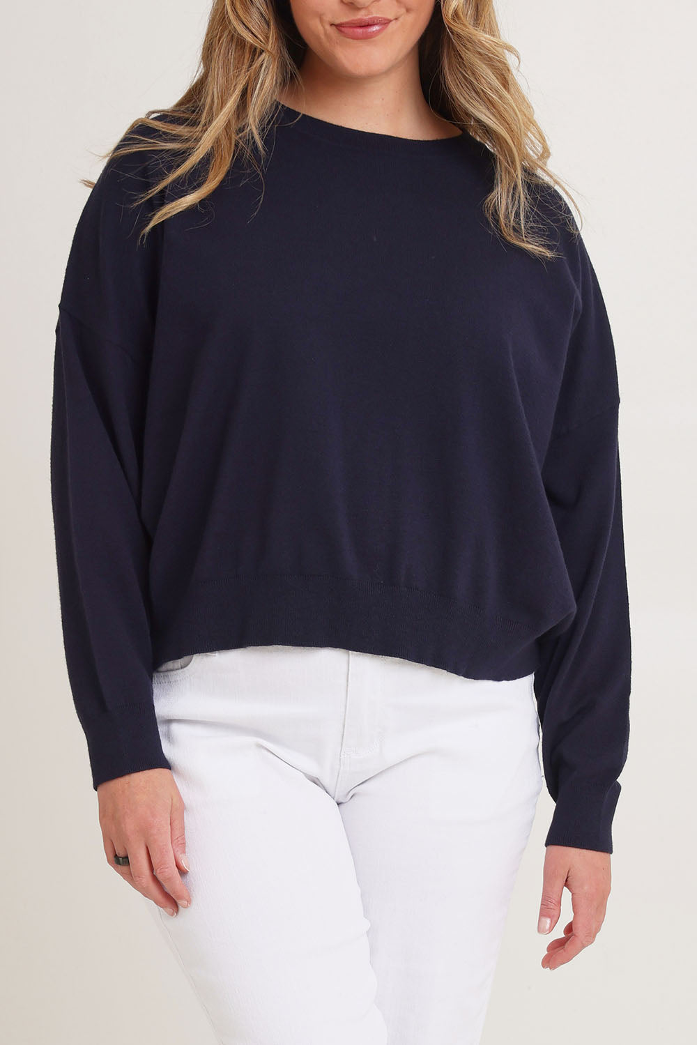 Model Chanel wearing size XL of The Essential Cropped Modal Blend Jumper in colour Navy (Blue), from the front, cropped image