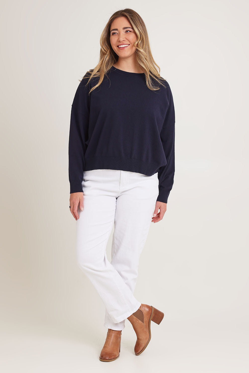 Model Chanel wearing size XL of The Essential Cropped Modal Blend Jumper in colour Navy (Blue), from the front, showing the whole outfit