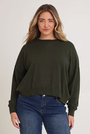 Model Chanel wearing size XL of The Essential Cropped Modal Blend Jumper in colour Pine (Green), from the front, cropped image
