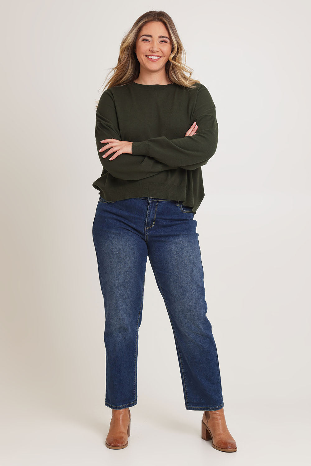 Model Chanel wearing size XL of The Essential Cropped Modal Blend Jumper in colour Pine (Green), from the front, showing the whole outfit