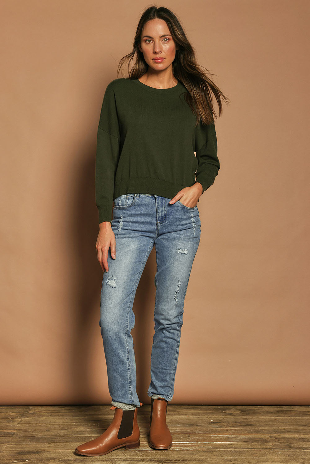 Model Madeline wearing size S of The Essential Cropped Modal Blend Jumper in colour Pine (Green), from the front, showing the whole outfit