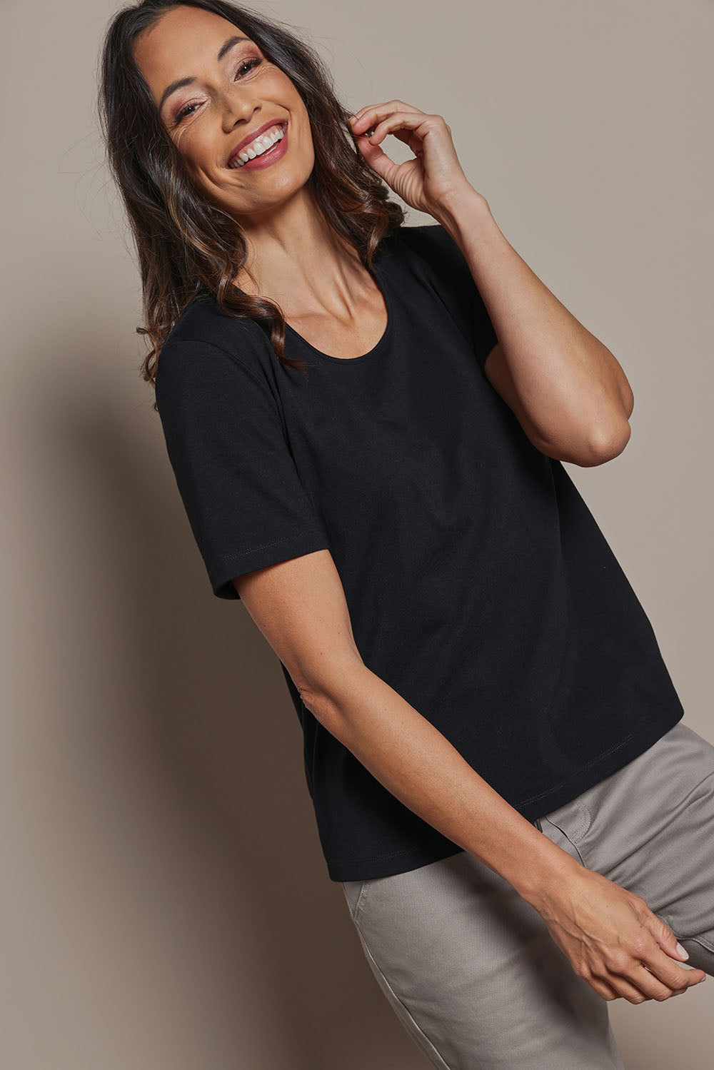 Model Amanda wearing size 10 of The Classic Cotton Blend Short Sleeve Tee in colour Black (Black), from the front, cropped image