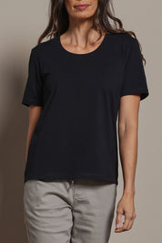 Model Amanda wearing size 10 of The Classic Cotton Blend Short Sleeve Tee in colour Black (Black), from the front, cropped image