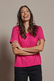 Model Amanda wearing size 10 of The Classic Cotton Blend Short Sleeve Tee in colour Blossom (Pink), from the front, cropped image