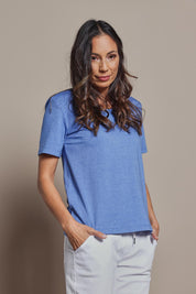Model Amanda wearing size 10 of The Classic Cotton Blend Short Sleeve Tee in colour Denim (Blue), from the front, cropped image