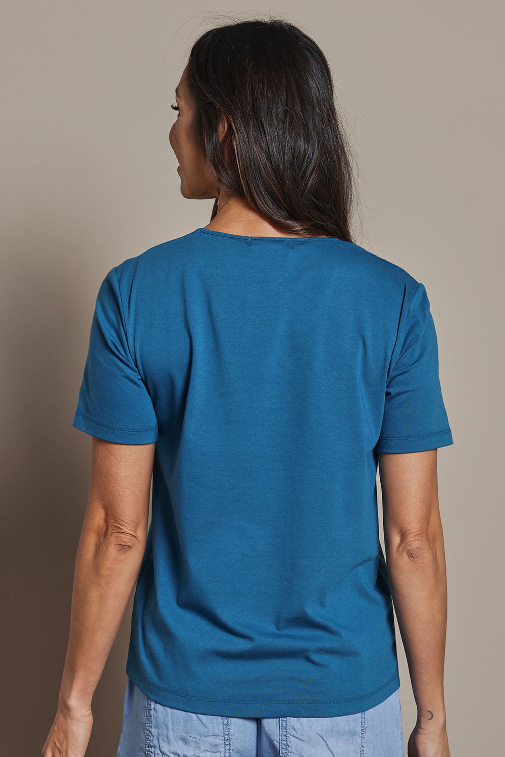 Model Amanda wearing size 10 of The Classic Cotton Blend Short Sleeve Tee in colour Petrol (Blue), from the back