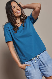 Model Amanda wearing size 10 of The Classic Cotton Blend Short Sleeve Tee in colour Petrol (Blue), from the front, cropped image