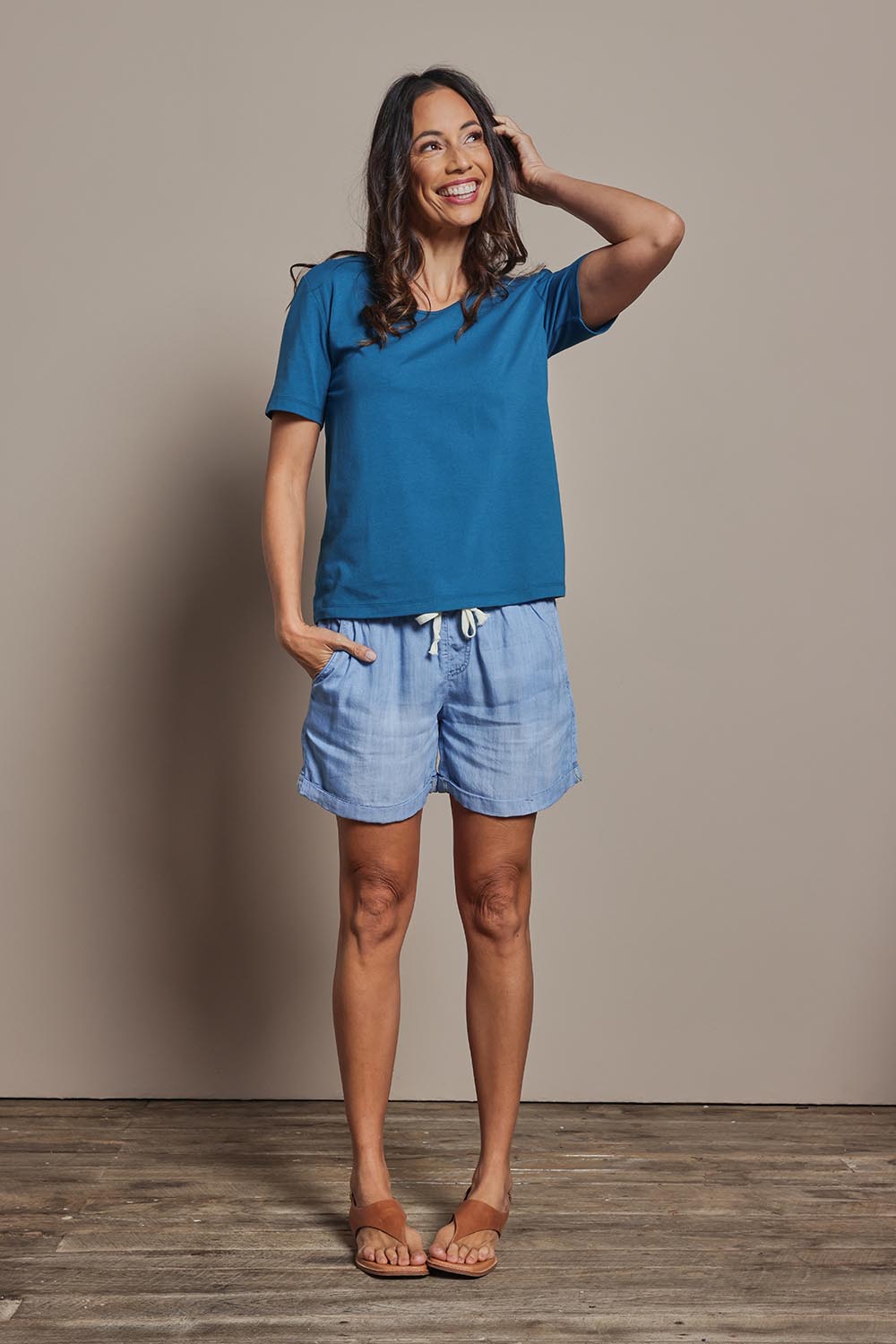 Model Amanda wearing size 10 of The Classic Cotton Blend Short Sleeve Tee in colour Petrol (Blue), from the front, showing the whole outfit