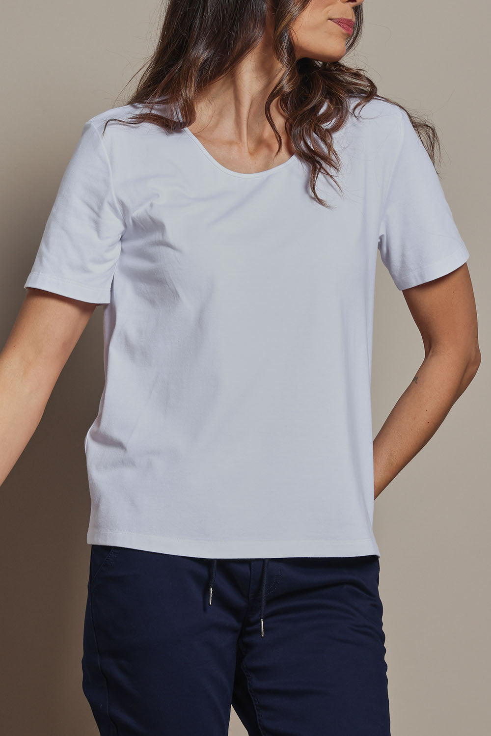 Model Amanda wearing size 10 of The Classic Cotton Blend Short Sleeve Tee in colour White (White), from the front, cropped image