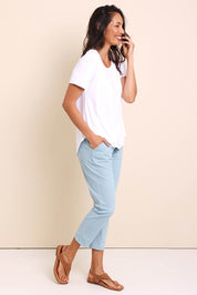 Model Amandam wearing size 10 of the The Pull On Cotton Pant With Drawstring – Aloe in colour Aloe, from the front