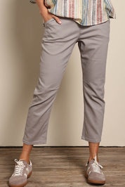 Model Amandam wearing size 10 of the The Pull On Cotton Pant With Drawstring – Biscuit in colour Biscuit, from an angle