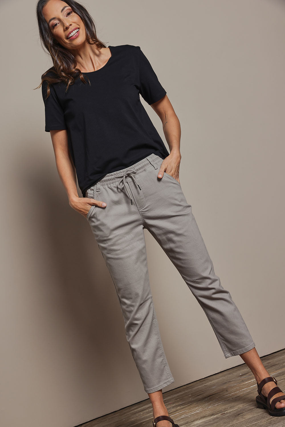 Model Abby wearing size 10 of The Pull On Cotton Pant With Drawstring in colour Biscuit, from the front, showing the whole outfit