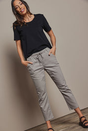 Model Abby wearing size 10 of The Pull On Cotton Pant With Drawstring in colour Biscuit, from the front, showing the whole outfit