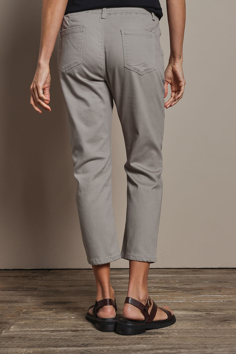 Model Amanda wearing size 10 of The Pull On Cotton Pant With Drawstring in colour Biscuit, from the back