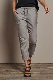 Model Amanda wearing size 10 of The Pull On Cotton Pant With Drawstring in colour Biscuit, from the front, cropped image