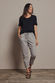 Model Amanda wearing size 10 of The Pull On Cotton Pant With Drawstring in colour Biscuit, from the front, showing the whole outfit