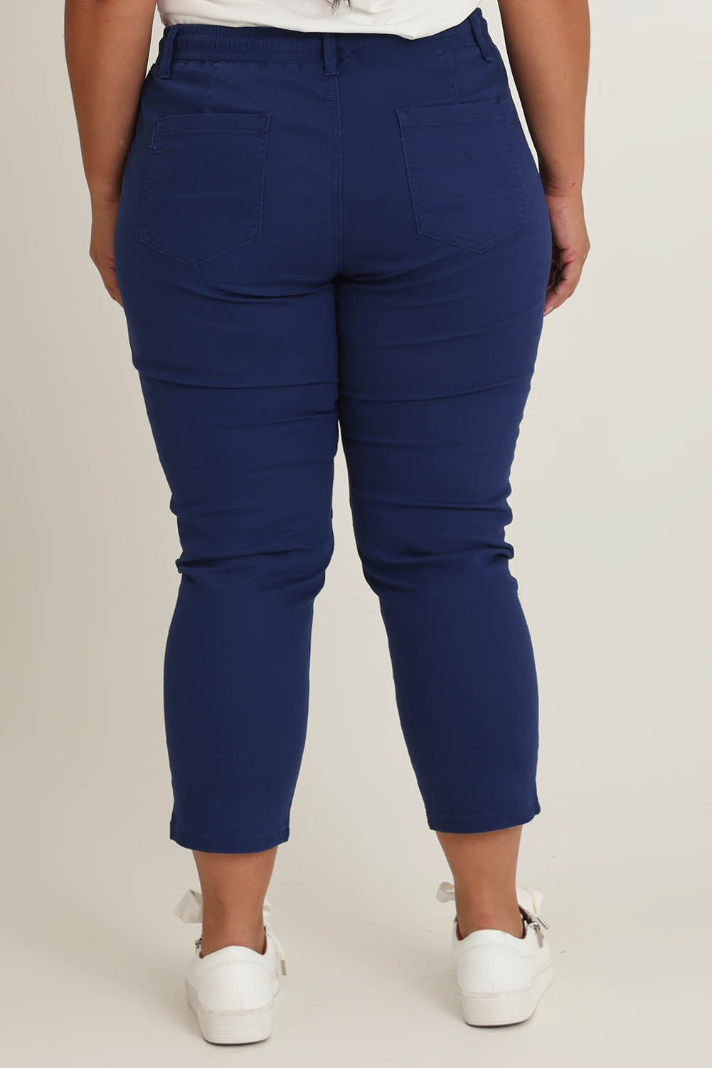 Model Ashleigh wearing size 16 of The Pull On Cotton Pant With Drawstring in colour Indigo (Blue), from the back