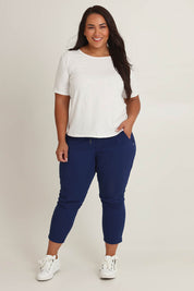 Model Ashleigh wearing size 16 of The Pull On Cotton Pant With Drawstring in colour Indigo (Blue), from the front, showing the whole outfit