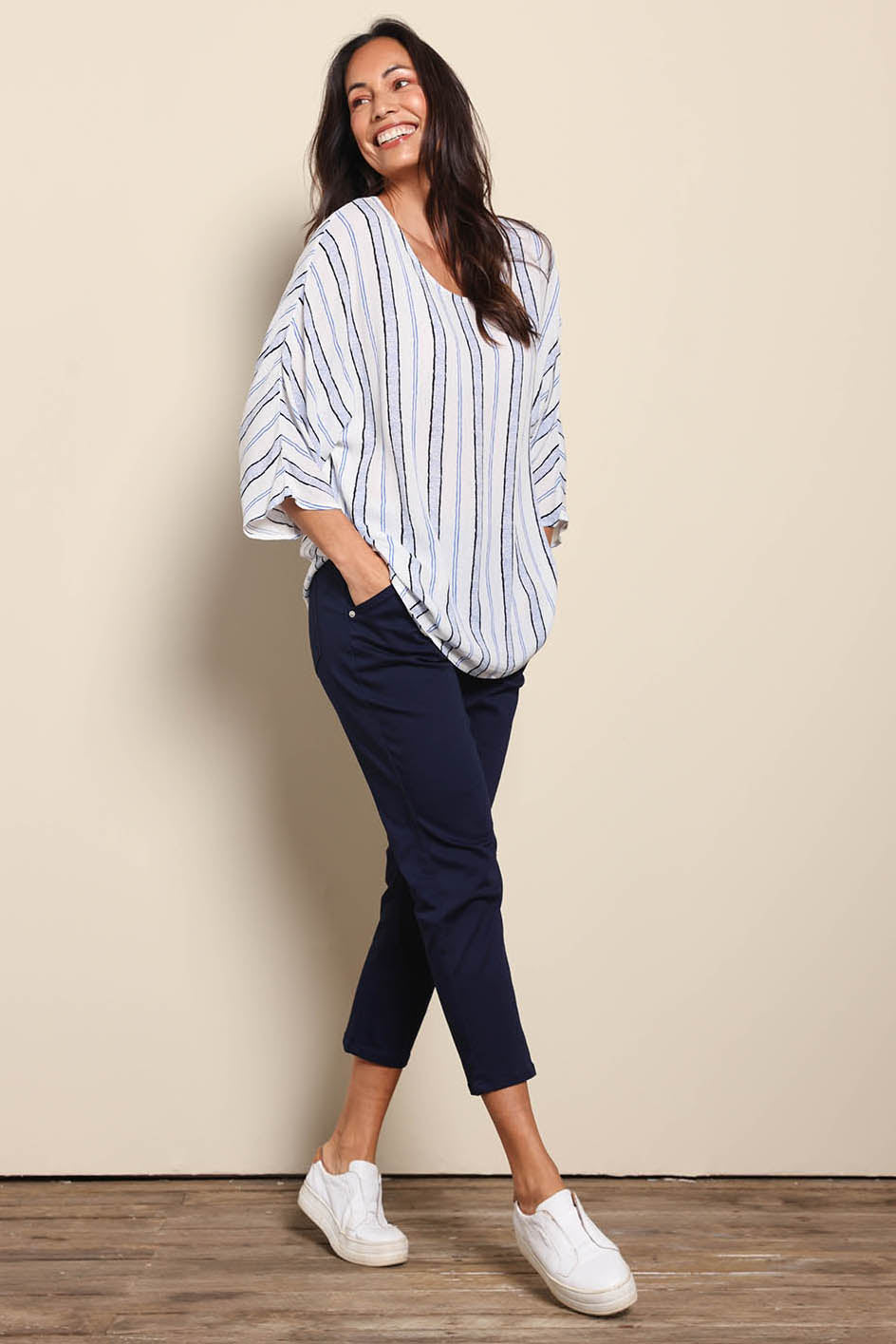 Model Amandam wearing size 10 of the The Pull On Cotton Pant With Drawstring – Navy in colour Navy, from the front