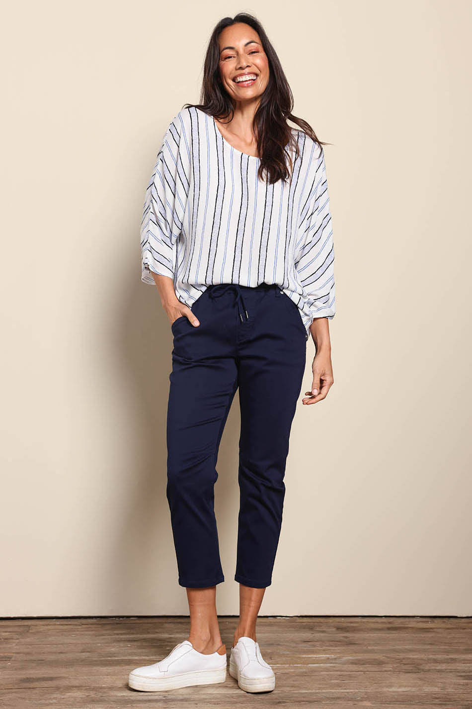 Model Amandam wearing size 10 of the The Pull On Cotton Pant With Drawstring – Navy in colour Navy, from the front