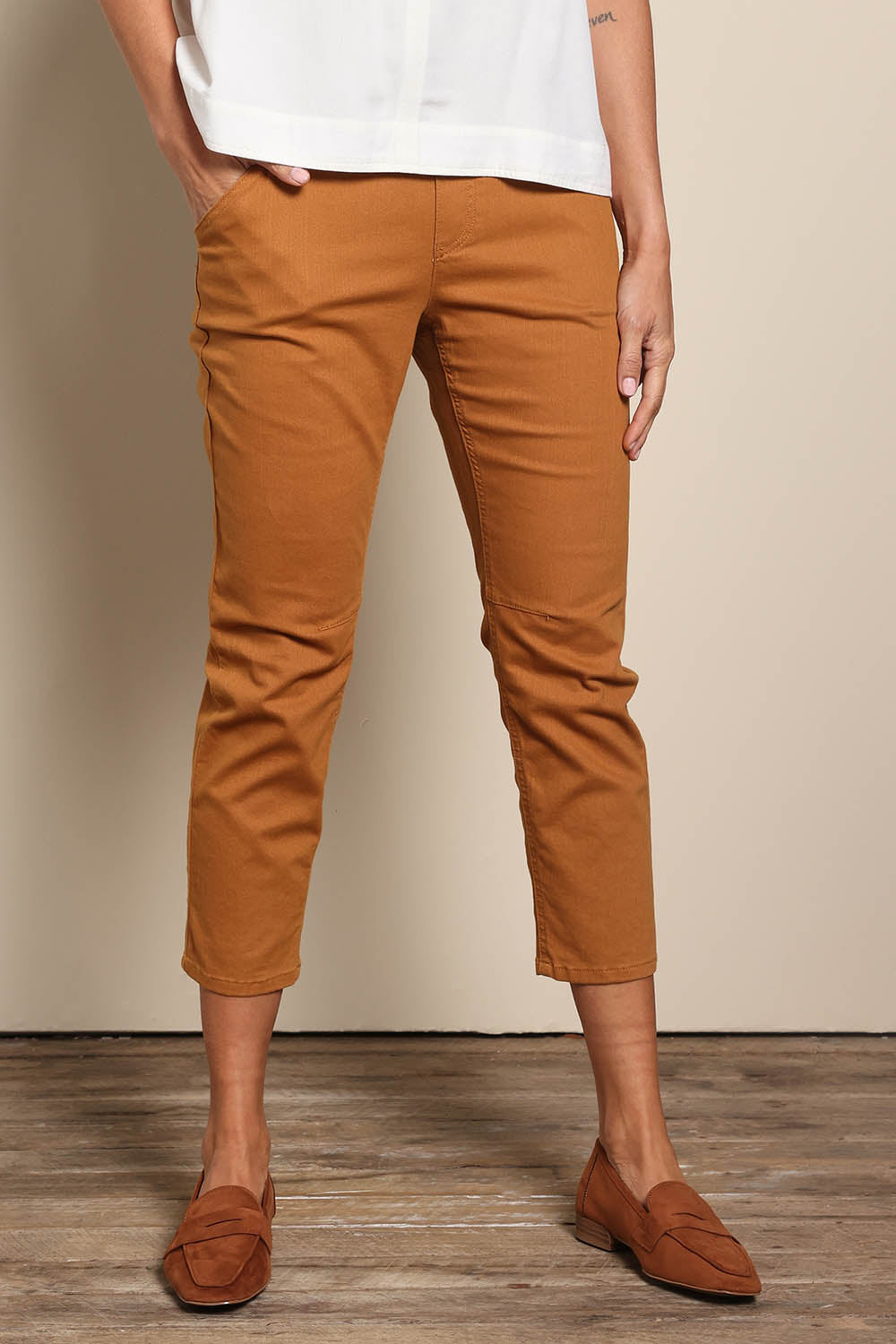 Model Amandam wearing size 10 of the The Pull On Cotton Pant With Drawstring – Rust in colour Rust, in a cropped view