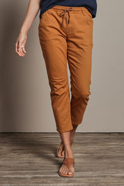 Model Amanda wearing size 10 of The Pull On Cotton Pant With Drawstring in colour Rust, from the front, cropped image