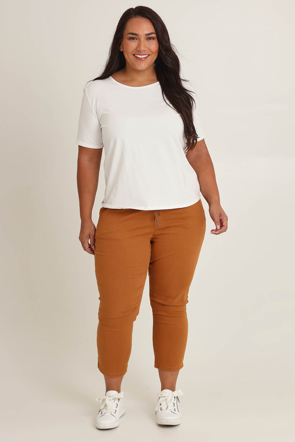 Model Ashleigh wearing size 16 of The Pull On Cotton Pant With Drawstring in colour Rust, from the front, showing the whole outfit
