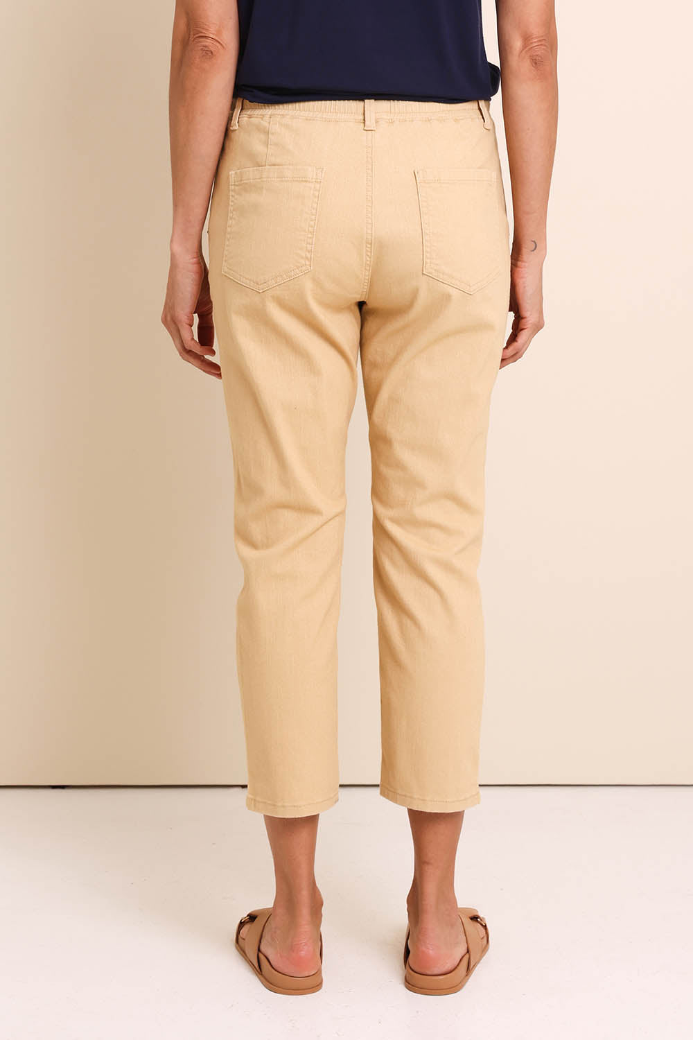Model Amandam wearing size 10 of the The Pull On Cotton Pant With Drawstring – Sand in colour Sand, from the front