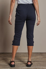 Model Amanda wearing size 10 of The Pull On Elastic Waist Cotton Blend Capri Pant in colour Navy (Blue), from the back