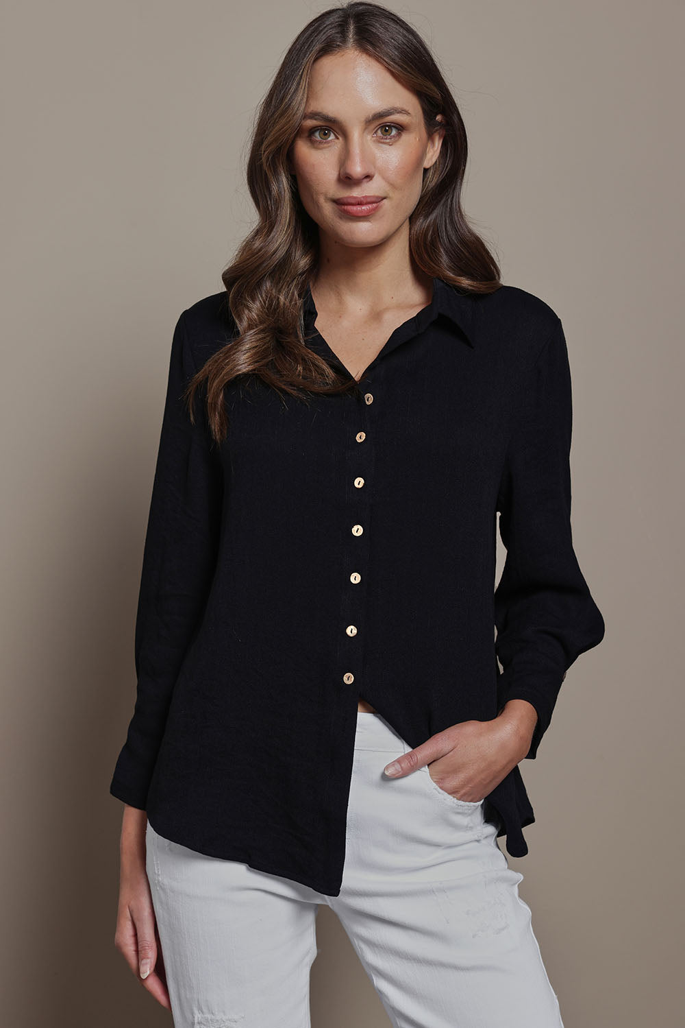 Model Madeline wearing size 10 of The Must Have Linen Look Shirt in colour Black (Black), from the front, cropped image