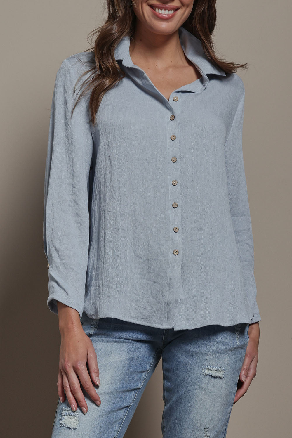 Model Madeline wearing size 10 of The Must Have Linen Look Shirt in colour Iceblue (Blue), from the front, cropped image