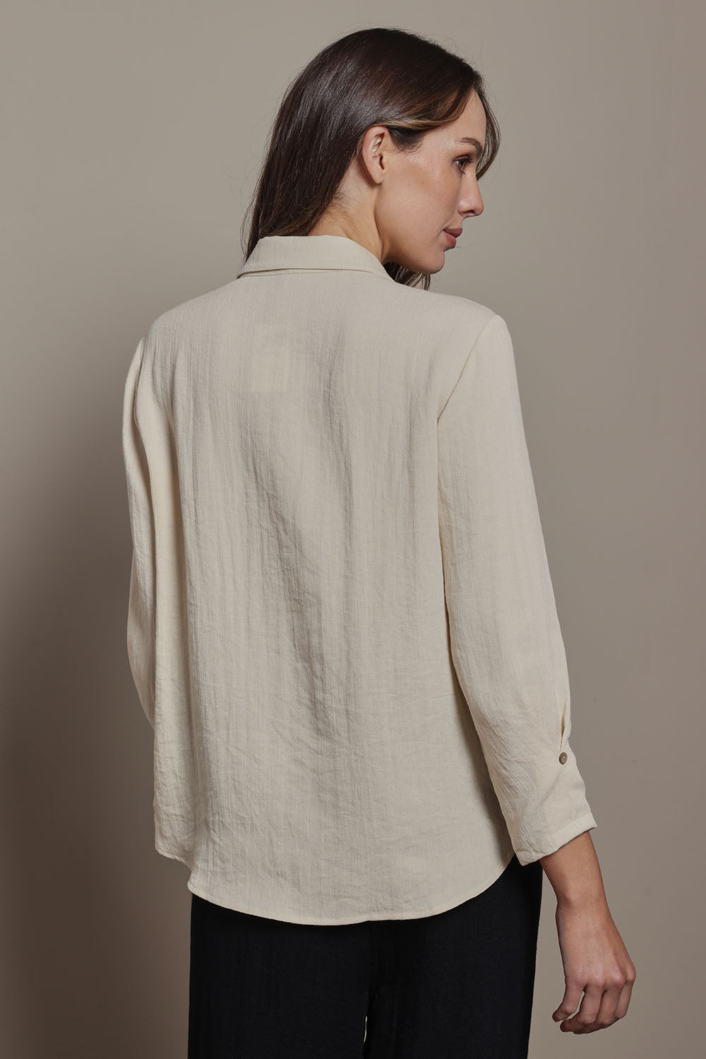 Model Madeline wearing size 10 of The Must Have Linen Look Shirt in colour Sand, from the back