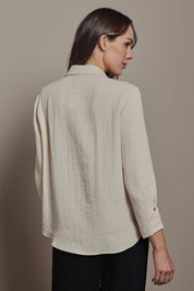 Model Madeline wearing size 10 of The Must Have Linen Look Shirt in colour Sand, from the back