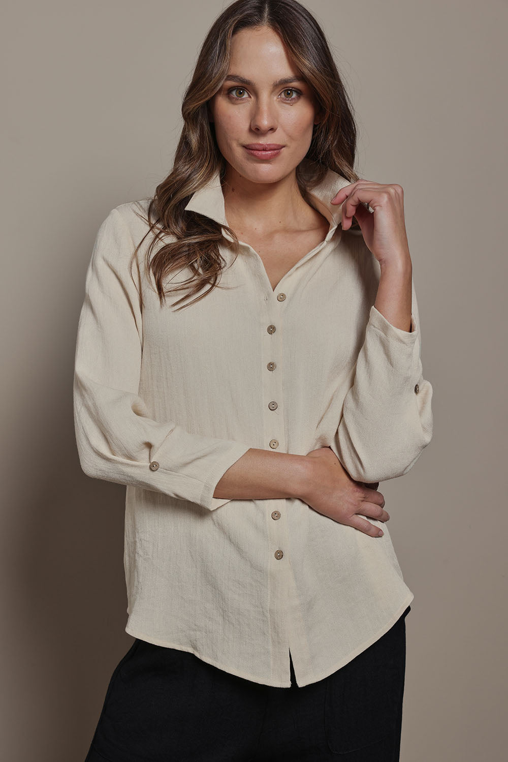 Model Madeline wearing size 10 of The Must Have Linen Look Shirt in colour Sand, from the front, cropped image