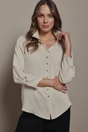 Model Madeline wearing size 10 of The Must Have Linen Look Shirt in colour Sand, from the front, cropped image